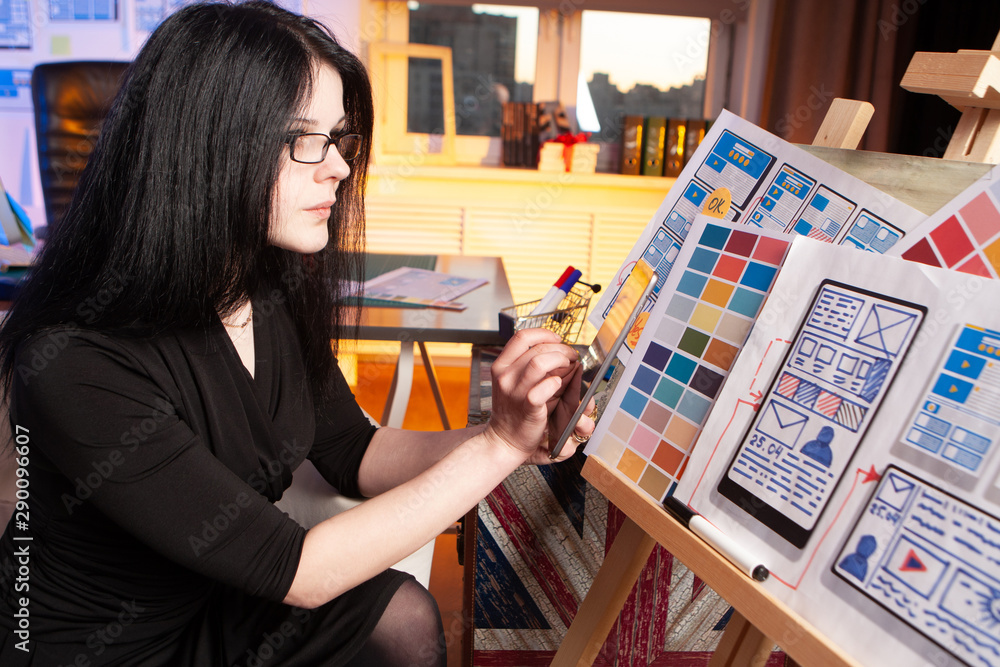 Poster the girl is developing a mobile application design. the designer checks the convenience of the devel