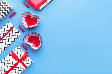 Person holding a present for Saint Valentine's day in his hands. Beautiful colorful background to st. Valentine day. Greeting card with red hearts. Wedding's invitation. Love expression