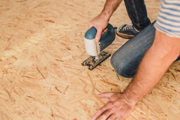 Installation of floor coverings - installation of a subfloor from sheets of plywood and OSB