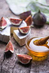 Dessert sweet set with ripe figs, honey and cheese.