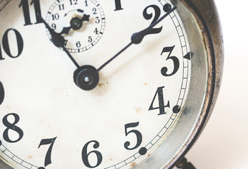 old analog clock with hands and numbers.