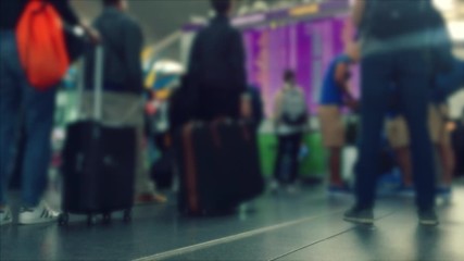 Defocusing. Busy Airport Terminal. Traveler at airport 