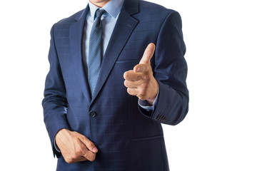 Young man in a blue suit points a finger on a white background