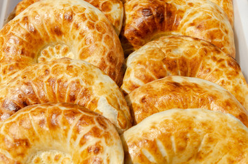 Pita bread with a Golden crust.A lot of lavash is on the table.