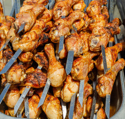 Barbecue of fried chicken legs.