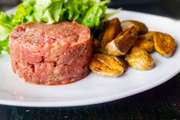 tasty Steak tartare (Raw beef) - classic steak tartare on white plate
