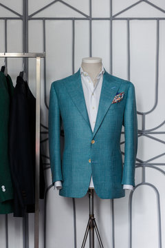 Mannequin with bespoke turquoise jacket in atelier	