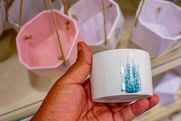 Kuala Lumpur, 1 September 2019 - artificial plants (succulent and cactus) pot with label, on sale at one of home improvement retailing store as interior decoration elements