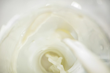 Fototapeta na wymiar Bright milk smooth background with splashes