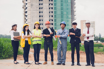 Obraz premium Happpy young Asian engineers ,construction site managers and businessmen in construction site