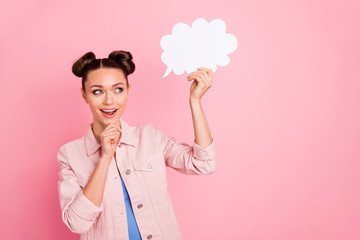 Portrait of pretty impressed youth holding paper card bubble thinking creative screaming wow omg wearing jacket isolated over pink background