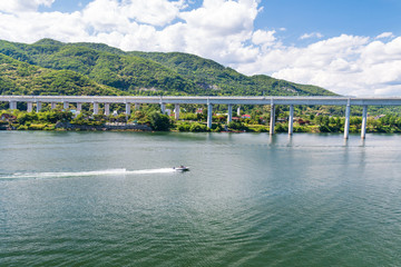 Aerial view photo of high speed water ski towed by speed boat in river