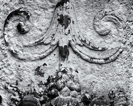 Part of column in garden.