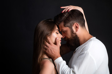 Loving man caressing hugging kissing woman. Sensual touch. Secrets fantasy. Satisfied girlfriend and boyfriend enjoying romantic moment.