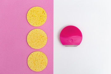 Alternative is electric facial brush or regular cosmetic sponges. Skin care, skin treatment. Flat lay. Top view.