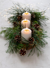 Burning candles on the Christmas table.