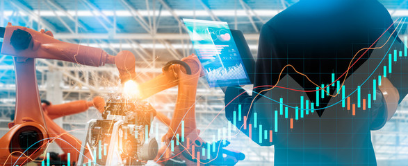 Robotics or digital intelligent manufacturing operation concept.Manager engineer control and check automation robot machine in intelligent factory.Supervisor management on real time monitoring system.