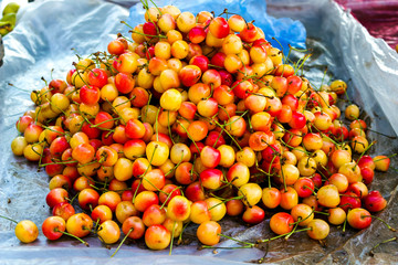 Sweet cherry background. Close-up of a beautiful ripe sweet cherry.