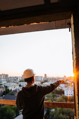 hard hat builder inside building under construction