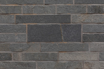 Close-up of natural stone rough tile surface, background.