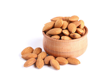 Almonds in bowl isolated on white background