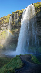 Seljalandsfoss huge waterfall in Iceland in sunny day with rainbow and blue sky in summer. - 290110445