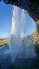 Seljalandsfoss huge waterfall in Iceland in sunny day with rainbow and blue sky in summer. - 290110457