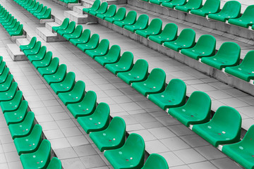 Diagonal view of empty green stadium seats ready for sport competition
