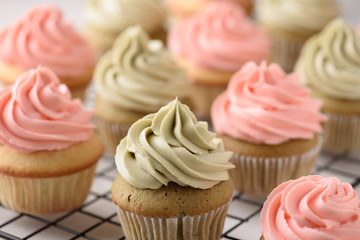 Many pink and green matcha cupcakes