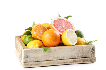Citrus fruits in wooden crate isolated on white background