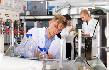 Male scientist working at biochemical laboratory