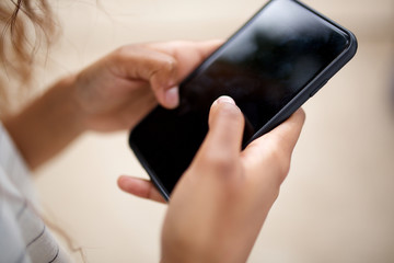 woman hands holding cellphone