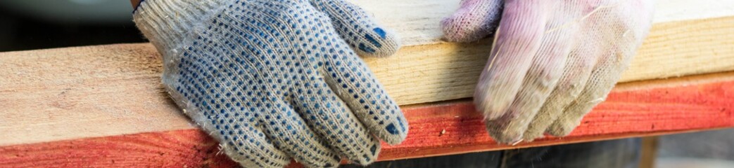 banner of hands working on the construction of the house