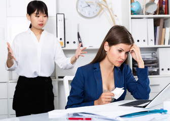 Upset woman with angry boss