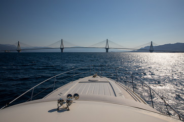 The Rio Antirrio Bridge or Charilaos Trikoupis Bridge, photo taken from the boat in summer morning.