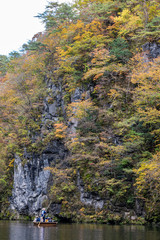 Geibikei Gorge River Cruises in Autumn foliage season. Beautiful scenery landscapes view in sunny weather day. Ichinoseki, Iwate Prefecture, Japan