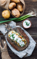 Potato pancakes with dill on rustic wooden cutting board