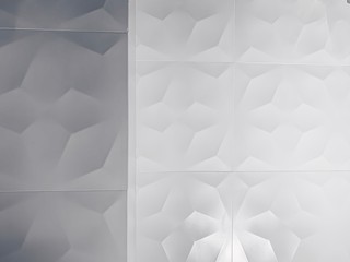 real photo of white ceramic tile shaded abstract geometric pattern. Origami paper style. 3D wall design rendering background