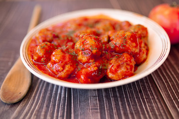 Meatballs in sweet and sour tomato sauce.