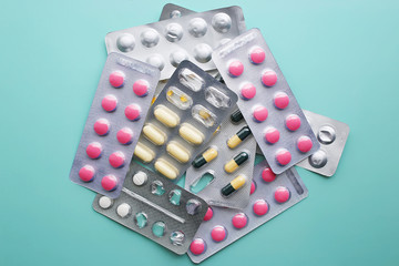 Medicine capsules and pills in blister packs.