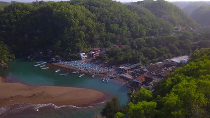 Aerial zoom shot : Fishing village at Sepanjang beach, Java island,Indonesia