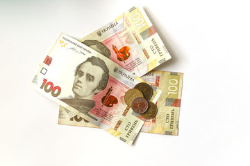 Ukrainian coins on the ukrainian banknotes background ukrainian money hryvnia on the white background