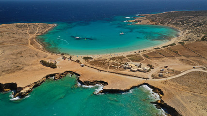 Aerial drone photo of iconic caves of Xylobatis or Ksylompatis in Koufonisi island, Small Cyclades, Greece