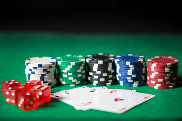 Cards, dice and chips to play poker.