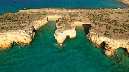 Aerial drone top view photo of beautiful volcanic rocky seascape with turquoise waters, Koufonisi island, small Cyclades, Greece