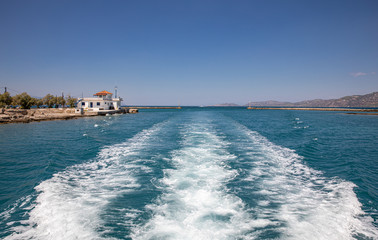 Passing through the Corinth Canal by yacht, Greece. The Corinth Canal connects the Gulf of Corinth...
