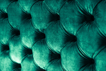 Emerald luxury velour quilted sofa upholstery with buttons, elegant green home decor texture and...