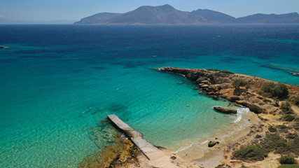 Aerial drone top view photo of beautiful volcanic rocky seascape with turquoise waters, Koufonisi island, small Cyclades, Greece