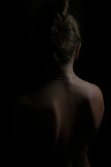Female body silhouette. Woman body lines on a dark background