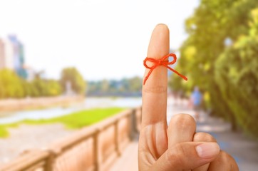 Rope bow on finger pointing